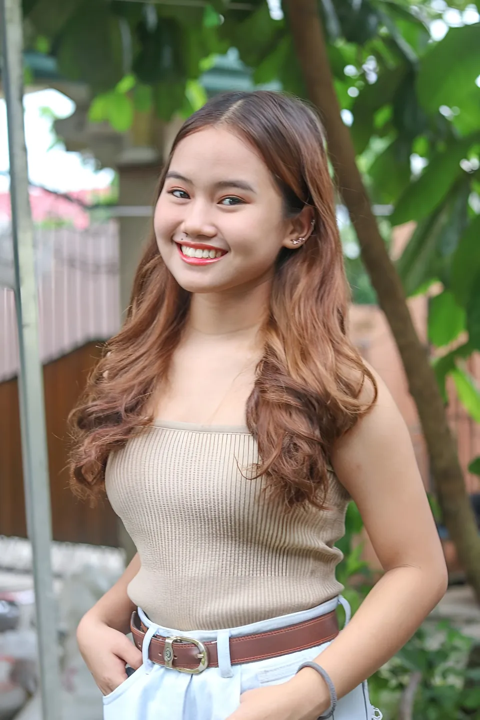 Elhaiza Maltao in beige top and light blue pants outdoors