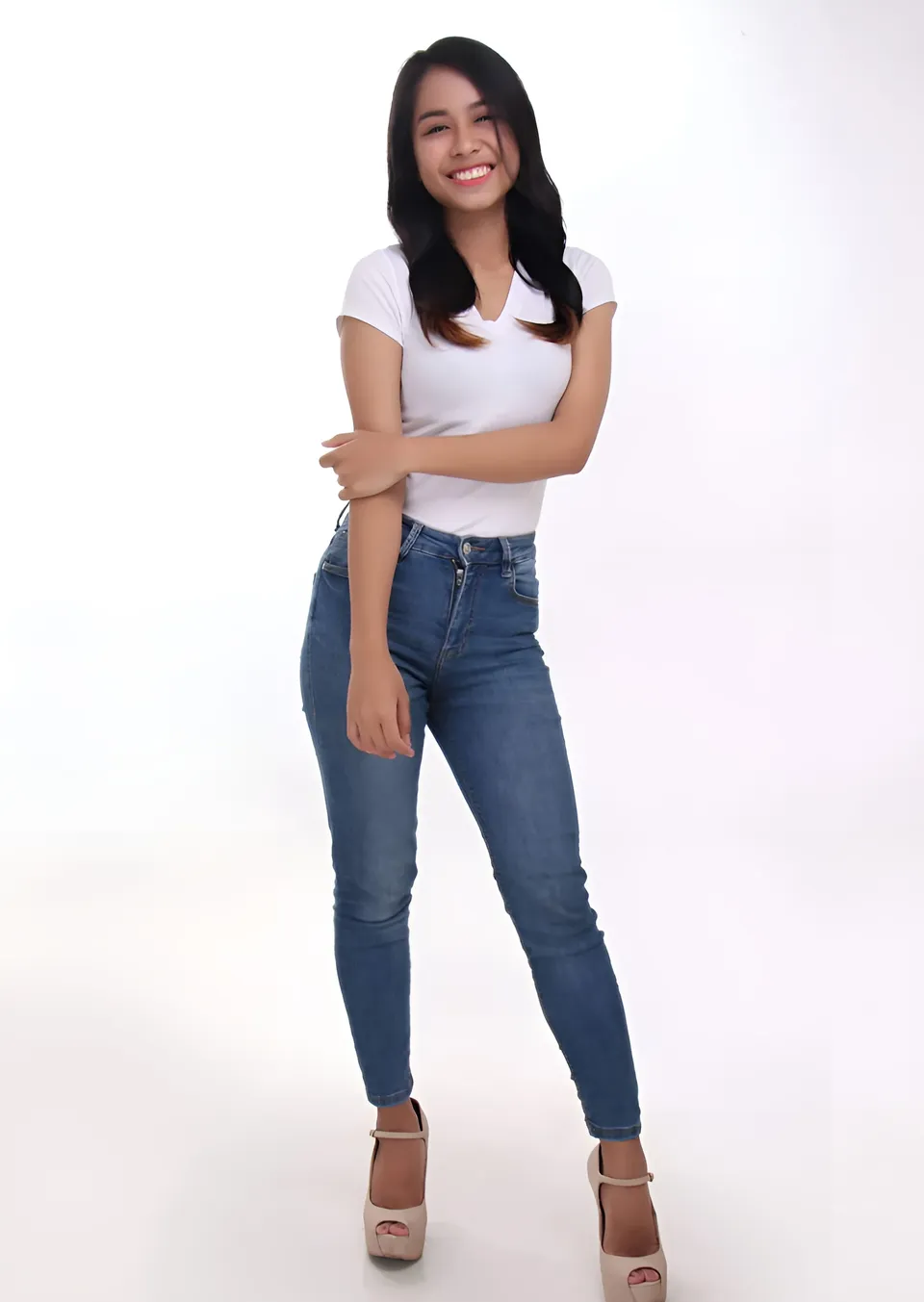 Francesca Ysabelle standing full body in white top and blue jeans