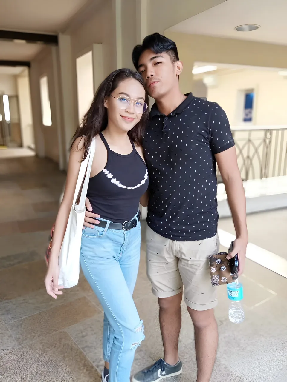 Gail Marquez — Two people standing together in hallway