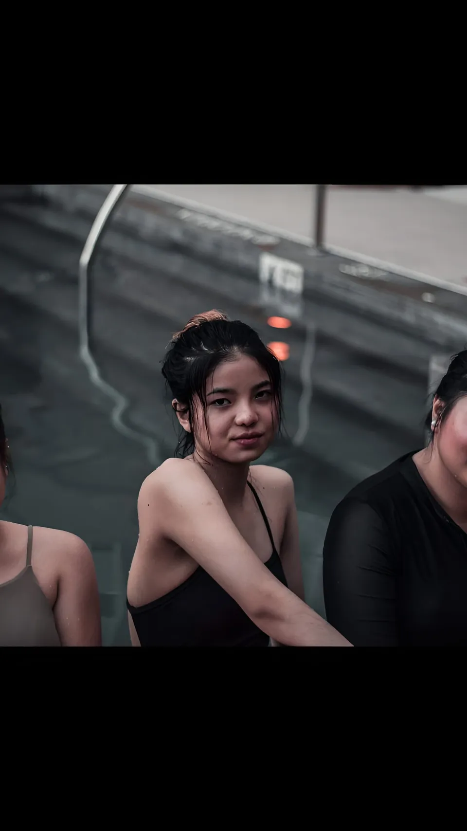 Jann Tiffany Mendoza — Three people in swimsuits near pool edge