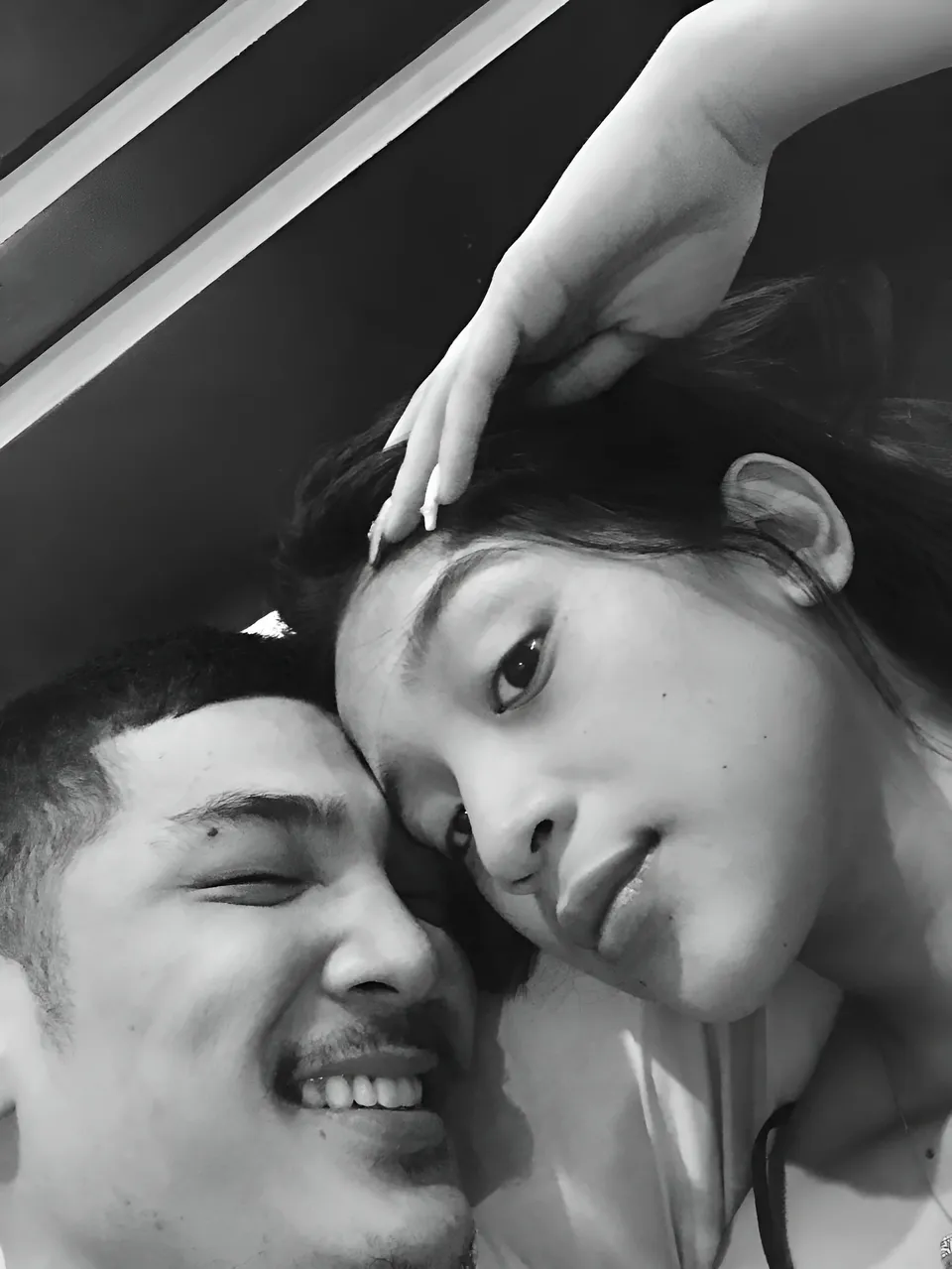 Jaymie Vale — Two people in close-up black and white portrait, one hand resting on head