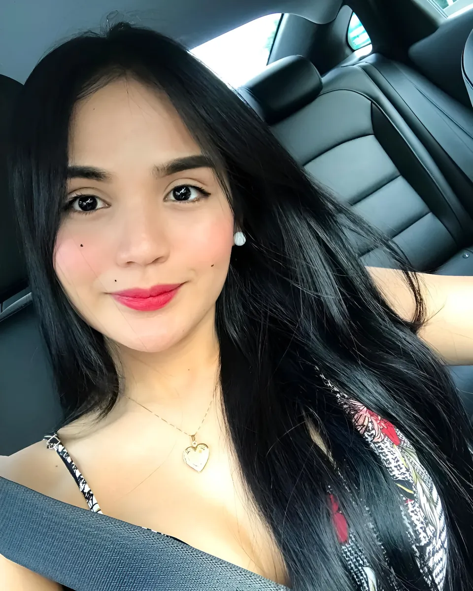 Joey Nerosa with long black hair seated in car interior