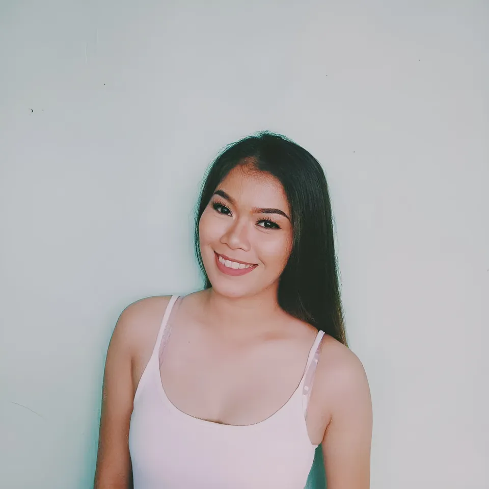 Joyme Magalona wearing a light pink top smiles against a plain wall