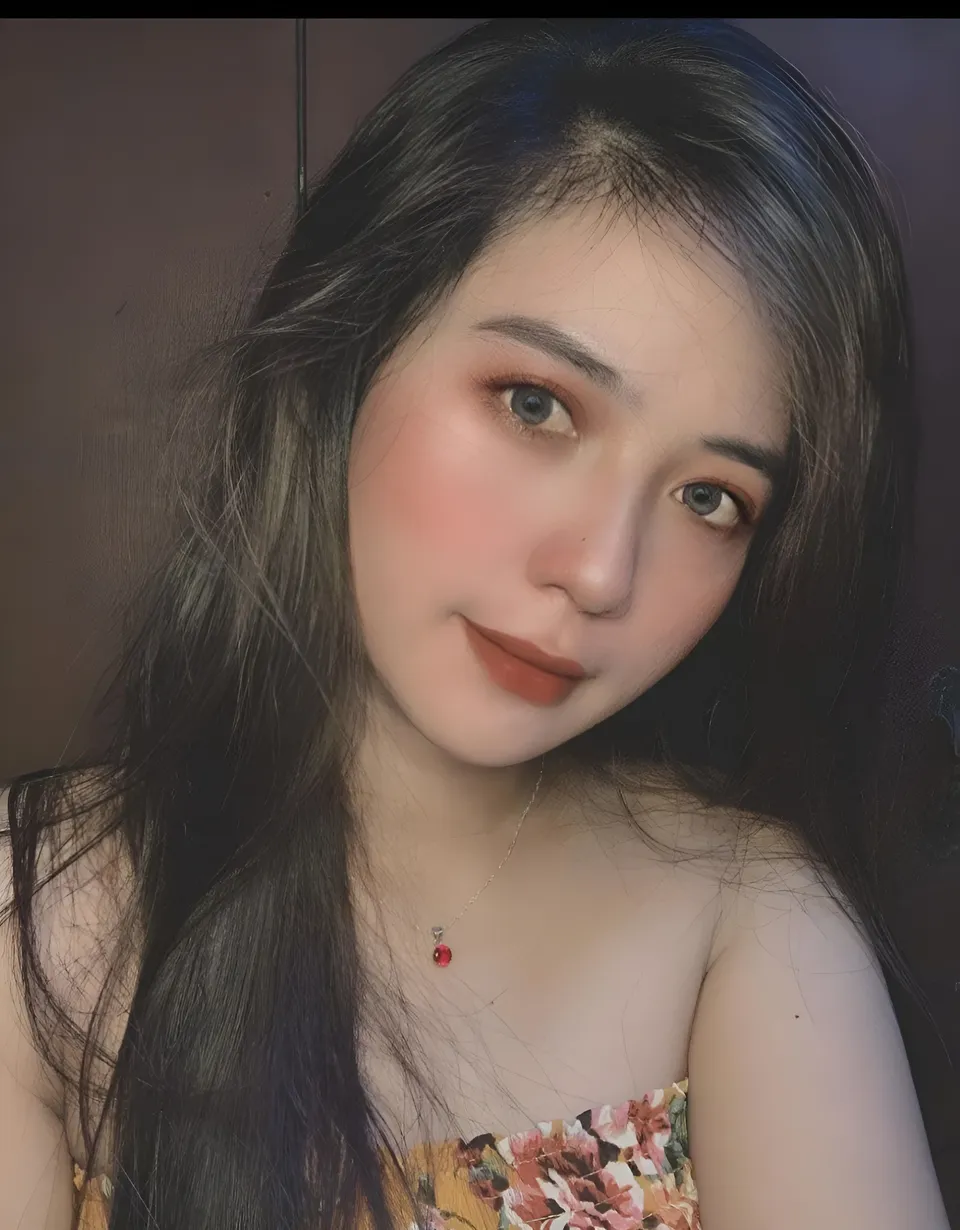 Mae Roxas in floral top with necklace and long hair