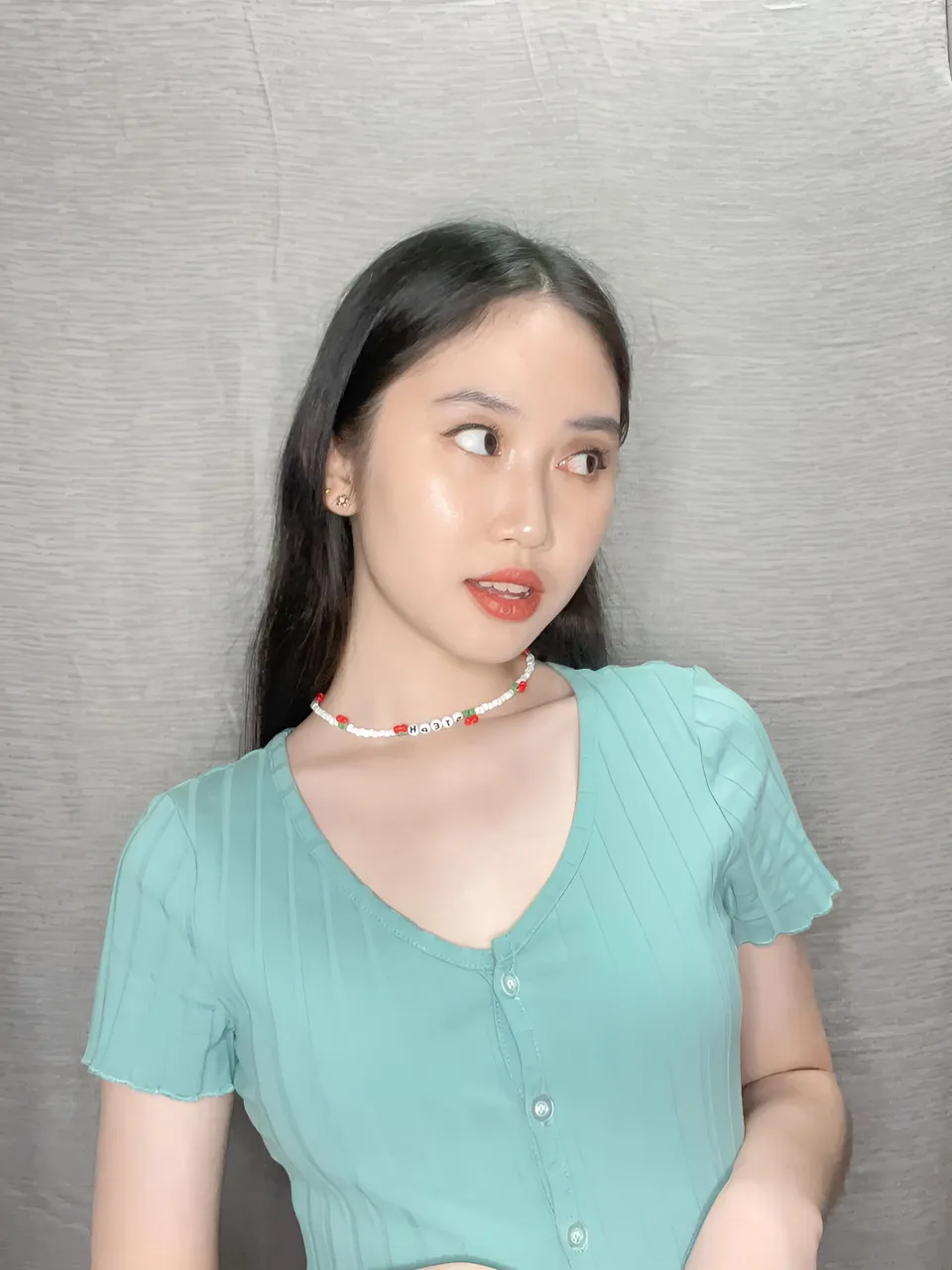 Stephanie Jean King wearing teal top with beaded choker necklace